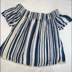 An off the shoulder shirt.